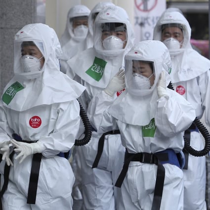 Health care workers arrive for duty at Dongsan Medical Centre in Daegu, South Korea. The city has seen a number of cases of recovered coronavirus patients testing positive again. Photo: AP