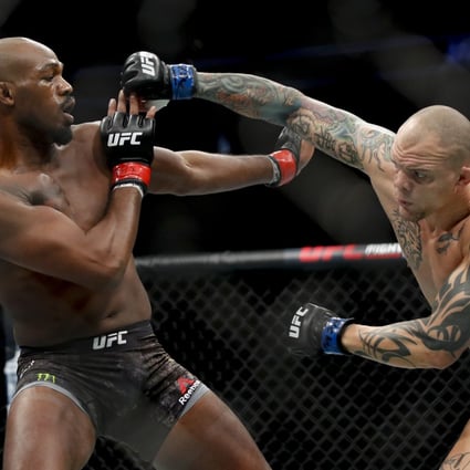 Jon Jones fights Anthony Smith in their light heavyweight title bout at UFC 235. Photos: AP