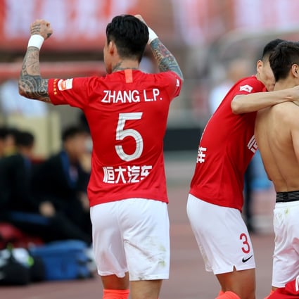 Guangzhou Evergrande players celebrate another Chinese Super League title in 2019. Photo: Xinhua