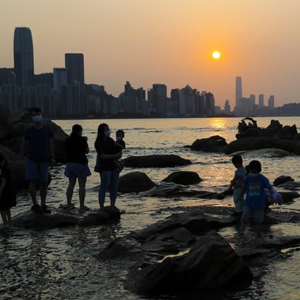 Families take in the sunset from Hong Kong’s Lei Yue Mun. Photo: Edmond So