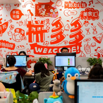 Staff members are seen at their desks inside the headquarters of Pinduoduo in Shanghai. Founded in 2015, the company operates China’s biggest e-commerce platform for agricultural goods. Photo: Reuters
