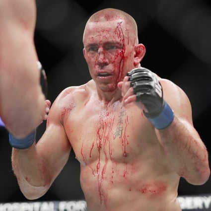 Georges St-Pierre faces Michael Bisping during their middleweight title bout at UFC 217. Photo: AP