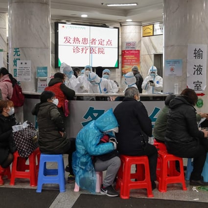 Medical staff in protective clothing try to cope with an influx of patients Wuhan Red Cross Hospital in the early days of the coronavirus epidemic. Photo: AFP