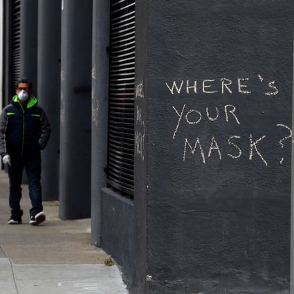 Graffiti in San Francisco, California, encouraging the wearing of masks. On Tuesday, it was announced that two residents of Santa Clara County, just south of the city, had died of the coronavirus weeks before the deaths previously believed to have been the first in the US. Photo: Getty Images via AFP