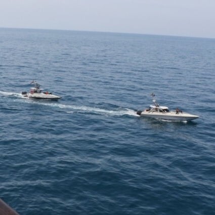 Iranian Islamic Revolutionary Guard Corps Navy (IRGCN) vessels are seen close to the USS Paul Hamilton and other US military ships, crossing the ships’ bows and sterns at close range while operating in international waters of the north Gulf. Photo: AFP