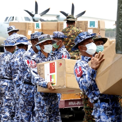 Myanmar soldiers unload medical supplies at Yangon International Airport on Friday. Photo: EPA-EFE