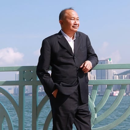 John Woo enjoys the view from the Harbour Grand Hotel, Whampoa Gardens in Hong Kong. The legendary director, who turns 74 on Friday, found his true calling in the 1980s as the main exponent of the so-called “heroic bloodshed” genre. Photo: Jonathan Wong