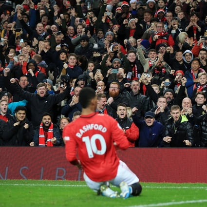 Fans cheer as Marcus Rashford celebrates scoring for Manchester United in the English Premier League match against Newcastle United at Old Trafford on December 26, 2019. Photo: Getty Images