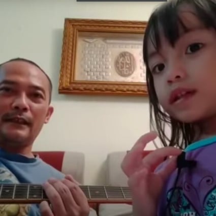Ujang Ijon and his three-year-old daughter Audrey perform Killing in the Name by US rockers Rage Against the Machine.