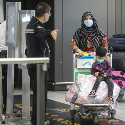 Hong Kong residents arrive back home from Pakistan on Thursday. Photo: K. Y. Cheng