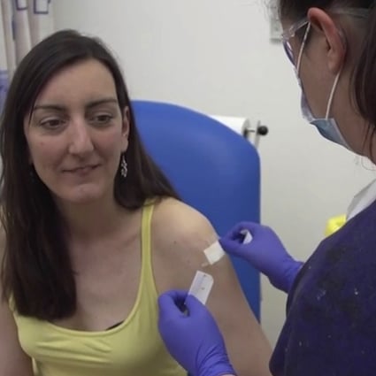 Microbiologist Elisa Granato gets an injection on Thursday as part of the first human trials in Britain for a potential coronavirus vaccine. Photo: University of Oxford via AP