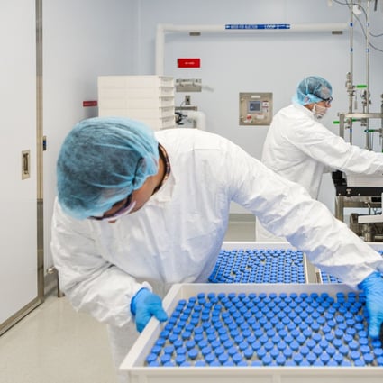 Lab technicians load filled vials of remdesivir at a Gilead Sciences facility in La Verne, California. Photo: Reuters