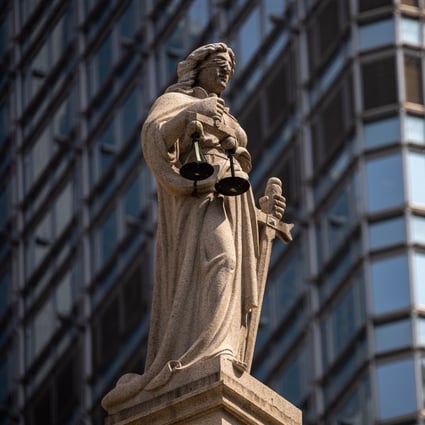 A statue of Lady Justice sits on top of the Court of Final Appeal in Central district. Hong Kong’s rule of law has been eroding since the handover, and now we might be looking at the end of it. Photo: EPA-EFE