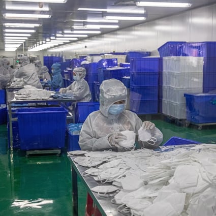 Employees in protective gear sort face masks at Zonsen Medical Products factory in Wuhan on April 12. In light of the coronavirus pandemic, governments are likely to pay more attention to medical supplies, deploying industrial policies to reduce dependence on imports and ensure sufficient domestic capacity in case of another outbreak. Photo: EPA-EFE