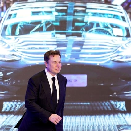Tesla Inc CEO Elon Musk walks next to a screen showing an image of Tesla Model 3 car during an opening ceremony for Tesla China-made Model Y program in Shanghai, China January 7, 2020. Photo: Reuters