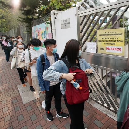 Student wait to start a Diploma of Secondary Education exam at the Textile Institute American Chamber of Commerce Woo Hon Fai Secondary School in Tsuen Wan. Photo: Felix Wong