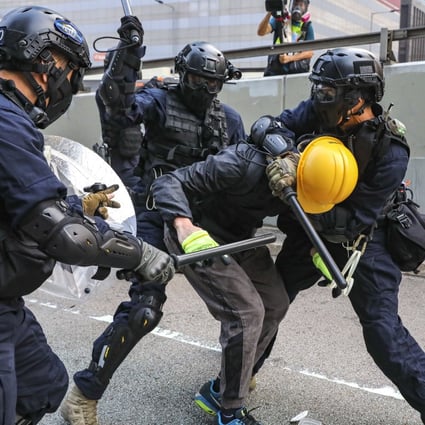 Hong Kong riot police arrest protesters following clashes during an anti-extradition bill march in September. Photo: K.Y. Cheng