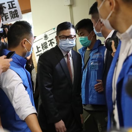 Chris Tang arrives at the meeting of Yuen Long District Council on Tuesday, where he said the girl was wanted by police. Photo: K.Y. Cheng
