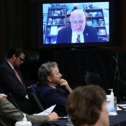 US senators and staff listen to Robert Redfield, director of the Centres for Disease Control and Prevention, as he speaks remotely during a Senate committee hearing. Photo: Reuters
