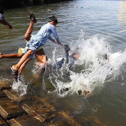 Children swim to beat the heat during the Muslim holy month of Ramadan in Sindh province, Pakistan. Photo: EPA