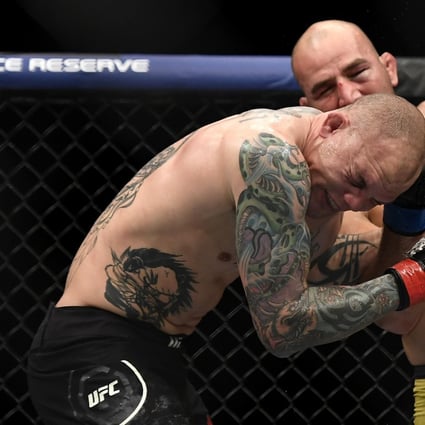Glover Teixeira lands a shot on Anthony Smith. Photo: AFP
