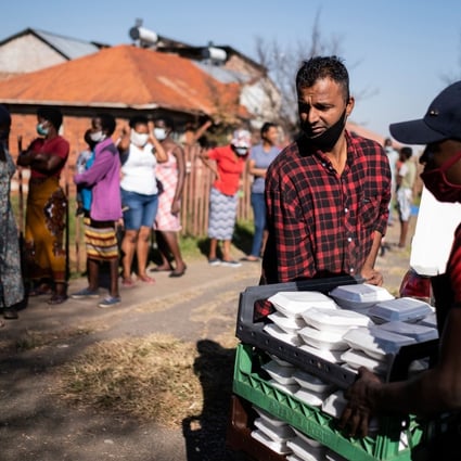 Members of a local charity deliver food in the Johannesburg suburb of Vrededorp on Tuesday, as South Africa and many other African countries start feeling the impact of the coronavirus pandemic. Photo: AFP