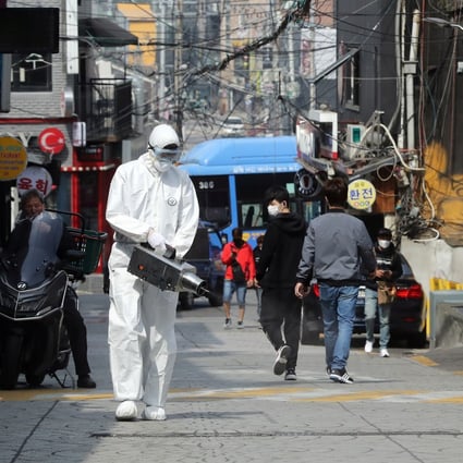Quarantine workers disinfect night spots in Itaewon, Seoul. Photo: Reuters