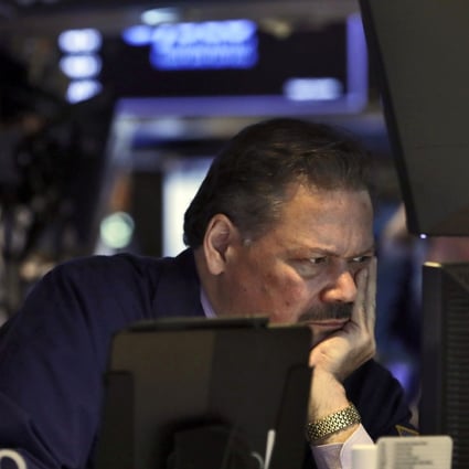 A trader on the floor of the New York Stock Exchange. Central banks may be exacerbating market vulnerabilities by increasing the scope for disorderly sell-offs when the time comes to unwind the stimulus. Photo: AP