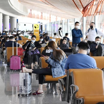 Passengers at a boarding area for domestic flights at the Beijing Capital International Airport on May 10, 2020. Photo: Kyodo