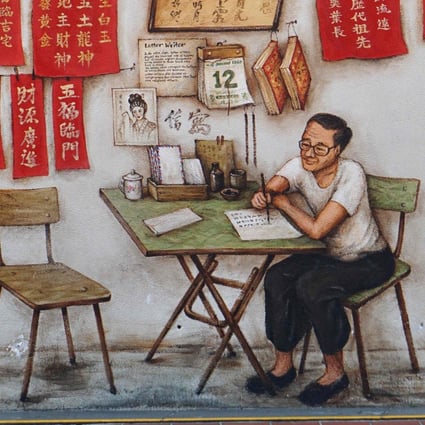 A man walks past a mural in Chinatown in Singapore. The city state is promoting its own distinctive cultural identity even as it capitalises on its shared cultural heritage to further ties with China. Photo: AFP