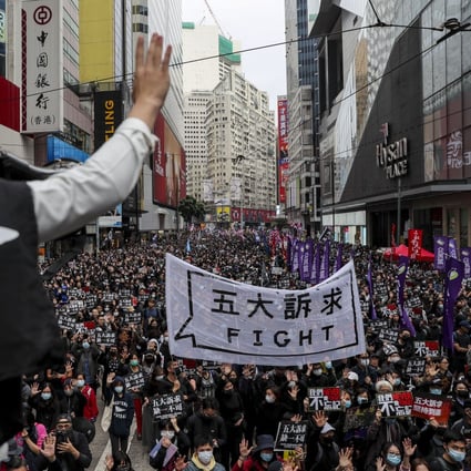 Protesters march through Causeway Bay on New Year’s Day. Photo: Sam Tsang