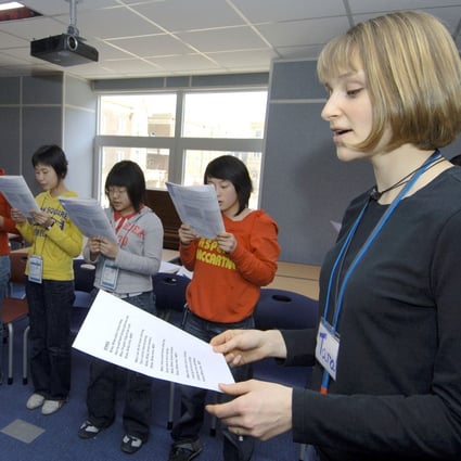 South Korean students take part in an English class with their foreign teacher in Paju, north of Seoul. Photo: AFP