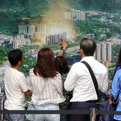 Prospective buyers visit a property sales office in Hong Kong in October 2019. The online viewing of property has become necessary for reducing physical interaction following the pandemic earlier this year. Photo: May Tse