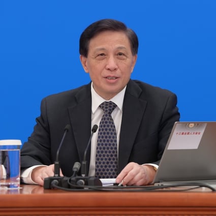 Zhang Yesui took questions from reporters on the agenda of the National People’s Congress via video link. Photo: Xinhua