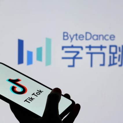 TikTok logos are seen on smartphones in front of a displayed ByteDance logo in this illustration. Photo: Reuters