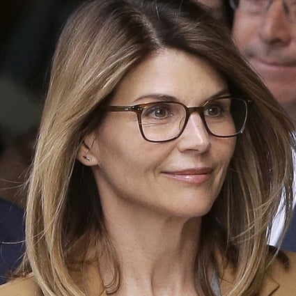 Actress Lori Loughlin and her husband, clothing designer Mossimo Giannulli. Photo: AP