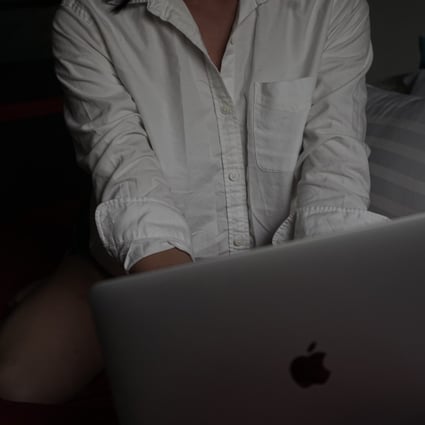 'Cherry', a transgender Thai sex worker, prepares to log on for a sex cam session from a Bangkok apartment. Photo: Vijitra Duangdee