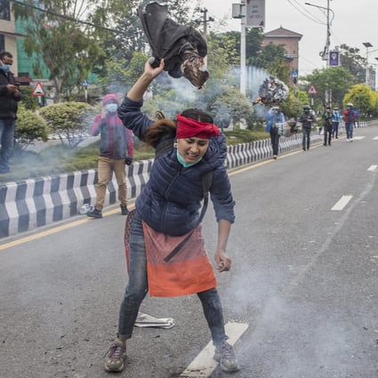 A Nepalese activist burns an image of Indian Prime Minister Narendra Modi during a protest in Kathmandu, Nepal. Photo: EPA