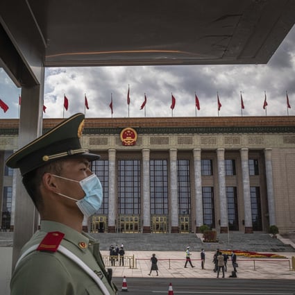 A People’s Liberation Army soldier stands guard during the annual meeting of the National People’s Congress in Beijing. Photo: AP