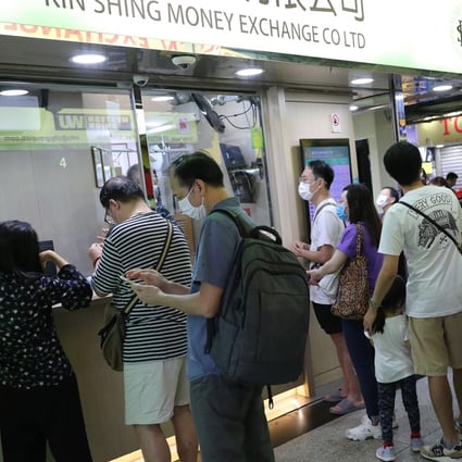 Queues formed at money changers in a number of Kowloon districts including at this shop in Tsim Sha Tsui. Photo: Edmond So