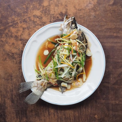 Steamed sea bass with ginger is just one of the recipes included in The Chinese Way: Healthy Low-fat Cooking from China's Regions by Eileen Yin-Fei Lo. Photo: Shutterstock