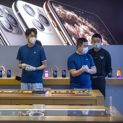 Employees wear face masks in a reopened Apple Store in Beijing. The US tech giant has joined China’s live-streaming e-commerce bandwagon. Photo: AP