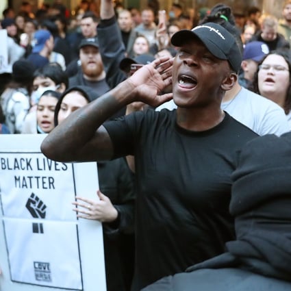 UFC middleweight champion Israel Adesanya joins some 4,000 New Zealand protesters demonstrating against the killing of Minneapolis man George Floyd in a Black Lives Matter protest in Auckland in June. Photo: AFP