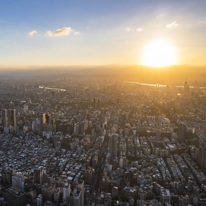 The sunset with downtown Taipei on the foreground, as seen from the observatory deck of the Taipei 101 skyscraper in Taiwan in August of last year. The government will unveil new incentives to attract fresh capital and talent in the island’s semiconductor industry. Photo: EPA-EFE