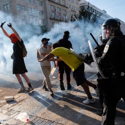 Police push back protesters near the White House during a demonstration against George Floyd’s death. Photo: AFP