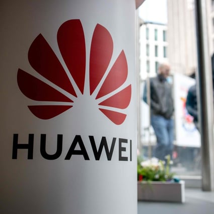 Pedestrians walk past a Huawei Technologies product stand at a shop of mobile network operator EE, part of the BT Group, in central London in April of last year. Photo: Agence France-Presse