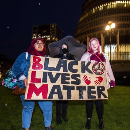 Protesters outside the New Zealand parliament in Wellington demonstrate against the killing by US police of Minneapolis man George Floyd. Photo: AFP