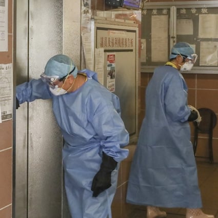 Cleaners in protective gear disinfect Lek Yuen Estate in Sha Tin. Photo: K.Y. Cheng