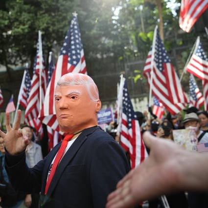 A Donald Trump impersonator gestures along with hundreds of people who gathered at Chater Garden on December 1 to thank the US president for signing the Hong Kong Human Rights and Democracy Act. The law allows Washington to suspend Hong Kong’s special trading status based on an annual certification by the US State Department about whether the city retains a sufficient degree of autonomy under the “one country, two systems” framework. Photo: Winson Wong