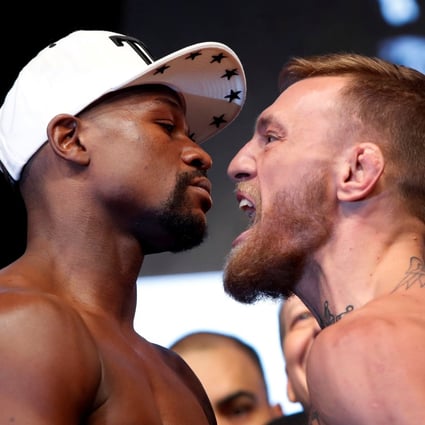 Undefeated boxer Floyd Mayweather Jnr and former UFC champion Conor McGregor face off at the official weigh-ins before their super fight at the T-Mobile Arena in Las Vegas, Nevada in 2017. Photo: Reuters